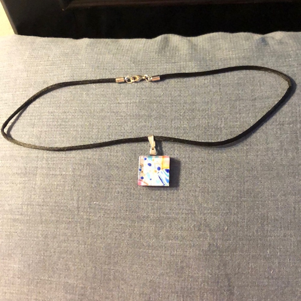 Ribbon necklace with blue and silver pendant